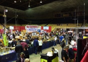 Dayton Hamvention show floor, a top ham radio destination, with vendors displaying ham radio equipment and participants exploring gear and treasures.