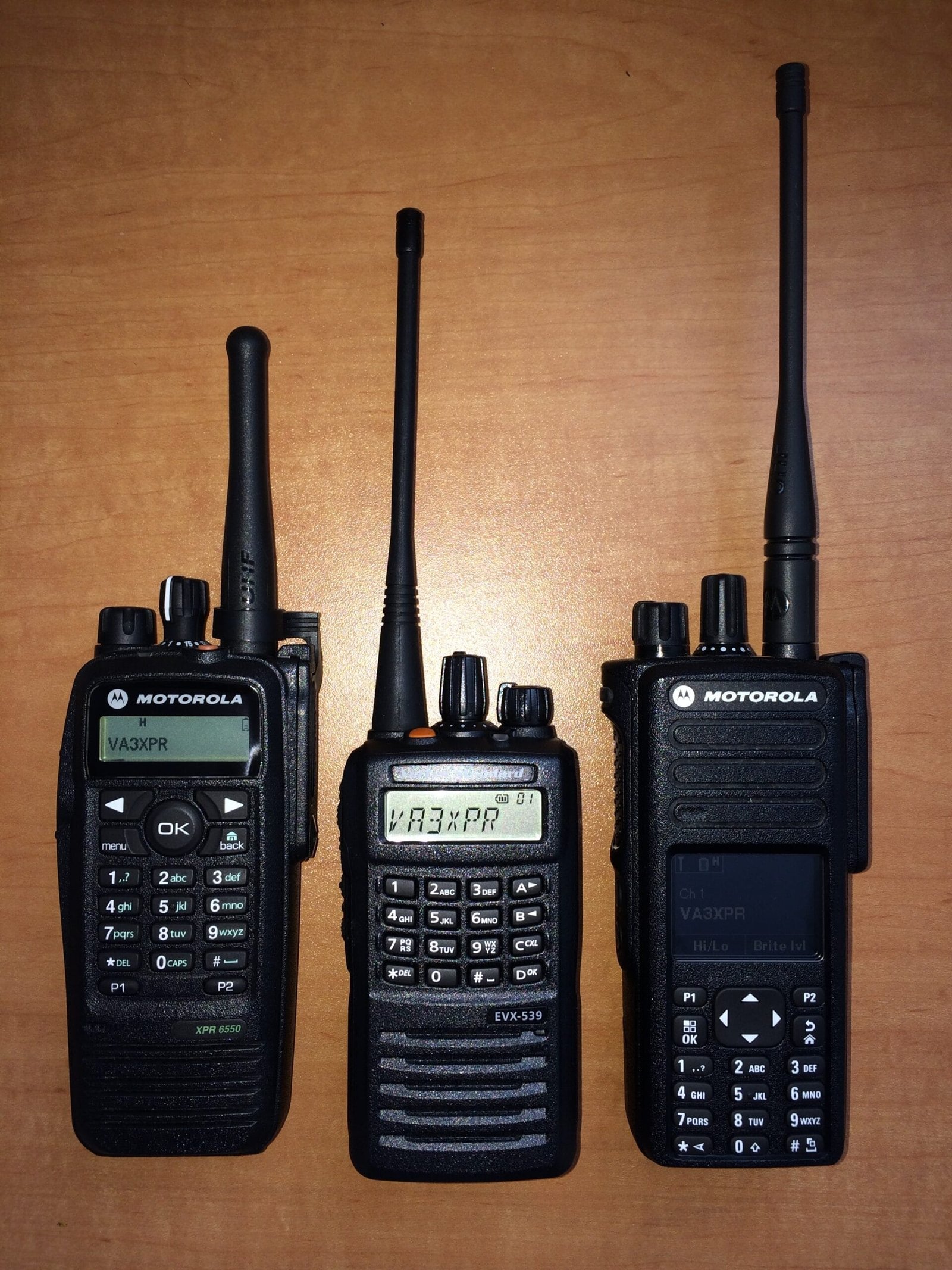 Front view of three DMR radios: Motorola XPR 6550, Vertex Standard EVX-539, and Motorola XPR 7550, showing their designs and displays.