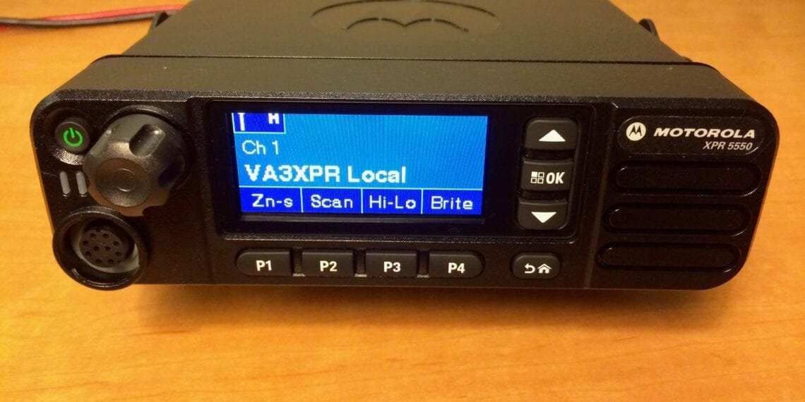 Motorola XPR 5550 DMR mobile radio showing front panel and color display.
