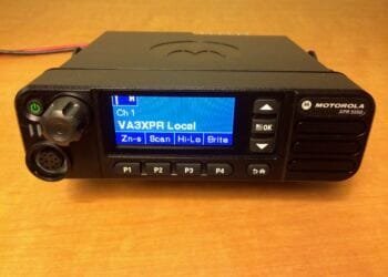 Motorola XPR 5550 DMR mobile radio showing front panel and color display.
