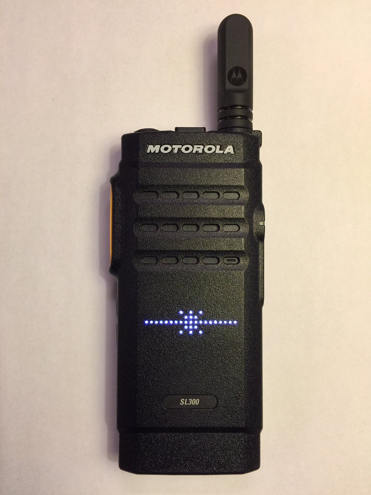 Front view of the Motorola SL300 DMR radio showing the illuminated matrix LED display.