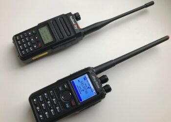 DMR for Beginners - Radioddity GD-77 and AnyTone AT-D878UV handheld radios side-by-side on a white background