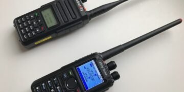 DMR for Beginners - Radioddity GD-77 and AnyTone AT-D878UV handheld radios side-by-side on a white background