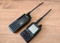 Photo showing Analog vs Digital Voice ham radios: iRadio UV-98Plus analog FM handheld next to a Yaesu FT2D Fusion digital handheld radio.