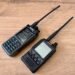 Photo showing Analog vs Digital Voice ham radios: iRadio UV-98Plus analog FM handheld next to a Yaesu FT2D Fusion digital handheld radio.