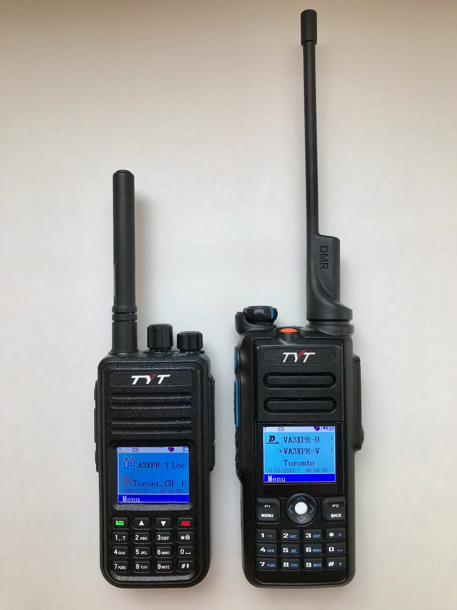 TYT MD-2017 dual-band DMR handheld radio next to TYT MD-380 for size and display comparison