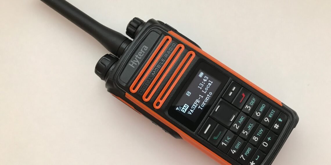 Hytera TD580 review - rugged orange-and-black DMR handheld radio with display and keypad.