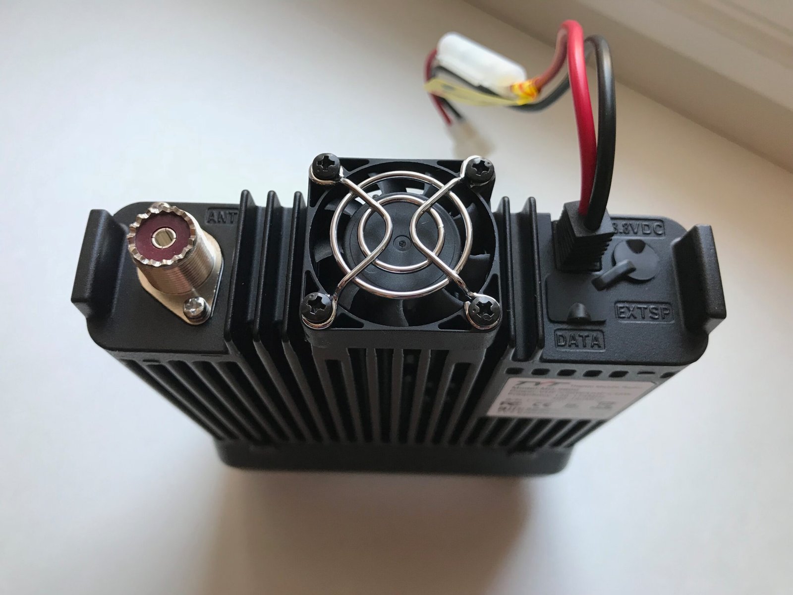 Rear panel of TYT MD-9600 dual-band DMR mobile radio showing antenna port, cooling fan, and power connections.