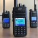 TYT MD-UV380 dual-band DMR handheld radio front view with MD-380 and MD-2017 models in background.