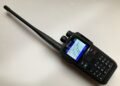 Connect Systems CS580 DMR handheld radio showing colour display and keypad layout.