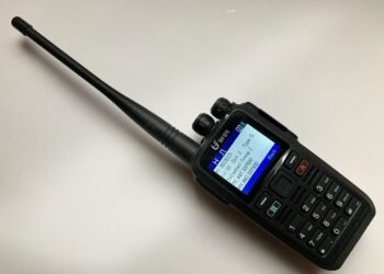 Connect Systems CS580 DMR handheld radio showing colour display and keypad layout.