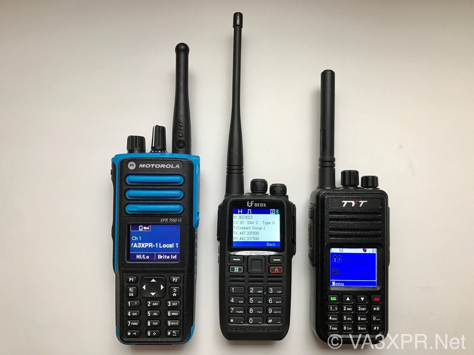 Connect Systems CS580 DMR handheld radio between Motorola XPR7550IS and TYT MD-380 showing size and display comparison.