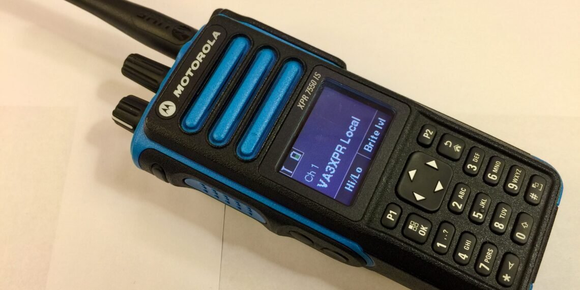 Motorola XPR7550 IS DMR handheld radio showing blue Intrinsically Safe housing and colour LCD display