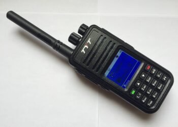 TYT MD-380 DMR handheld radio showing its colour LCD display and keypad.
