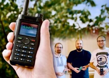 Prototype LinHT Linux-based SDR handheld radio displayed with members of the development team. Photo credit: CQ DL / DARC